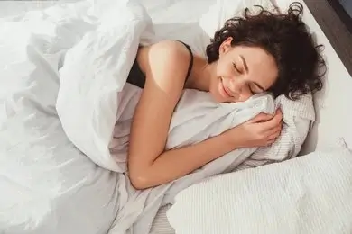 Women balancing hormones for better sleep with natural methods like diet, supplements, and self-care.