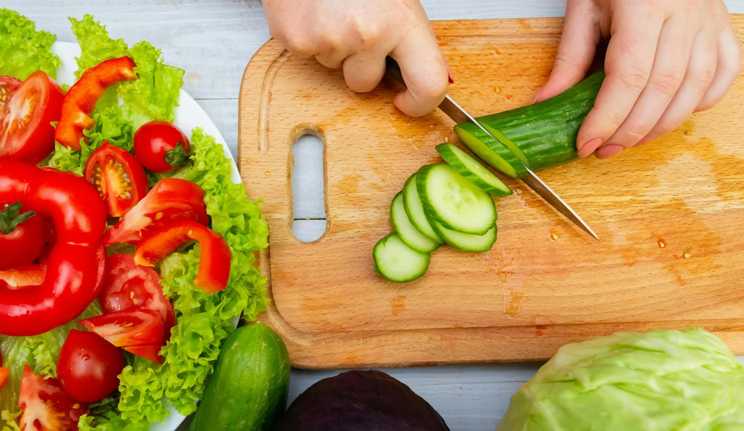 Midlife woman enjoying a healthy Mediterranean meal with fresh vegetables
